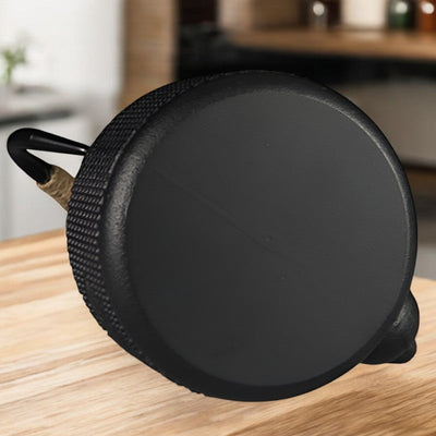 Théière en fonte avec filtre pour le thé