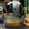Théière en fonte noir et doré
