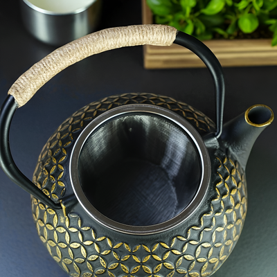 Théière en fonte noir et doré
