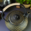 Théière en fonte noir et doré