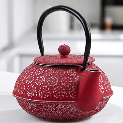 Théière en fonte rouge