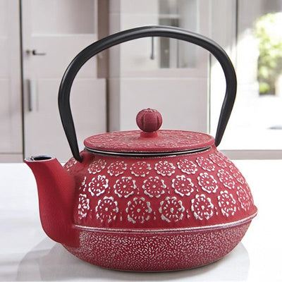 Théière en fonte rouge