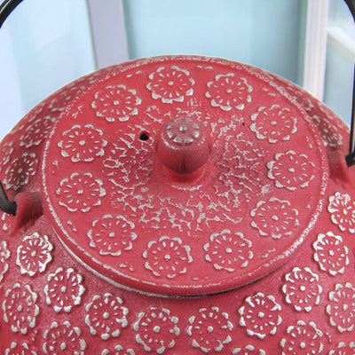 Théière en fonte rouge