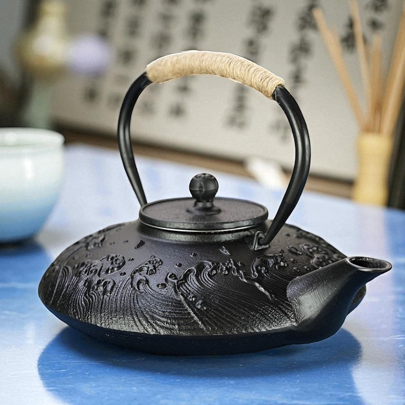 Théière plate en fonte