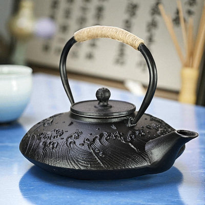Théière plate en fonte