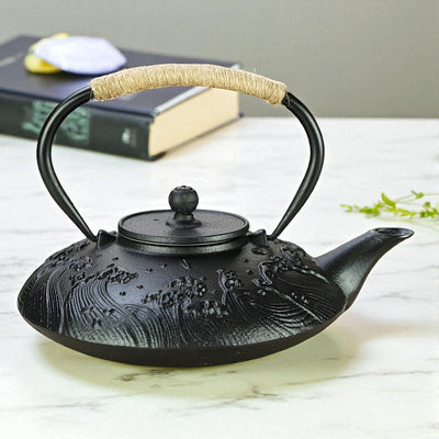 Théière plate en fonte