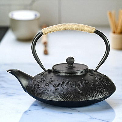 Théière plate en fonte