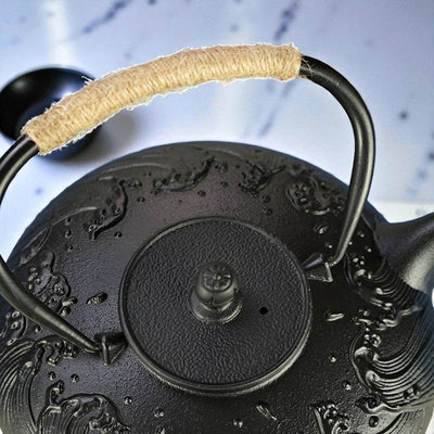 Théière plate en fonte