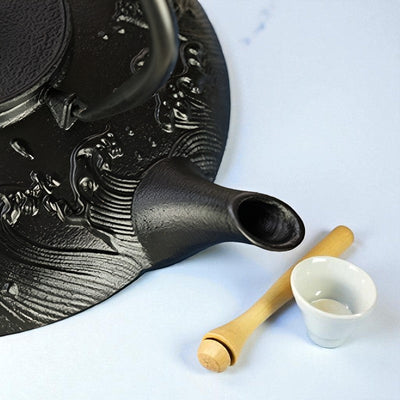 Théière plate en fonte