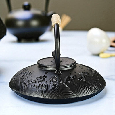 Théière plate en fonte