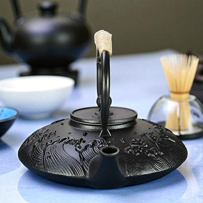 Théière plate en fonte