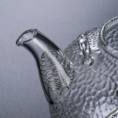 Théière transparente avec motif