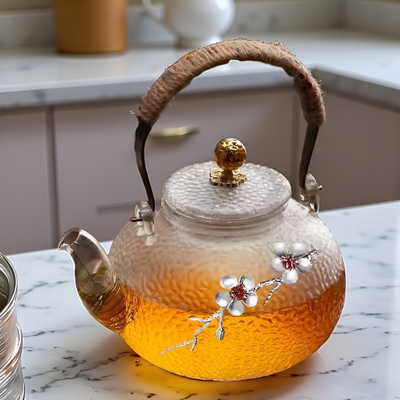 Théière transparente avec motif