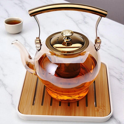 Théière en verre et doré