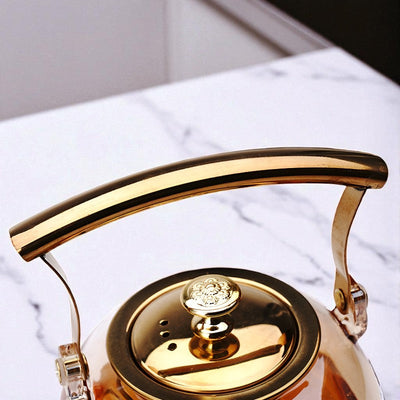 Théière en verre et doré