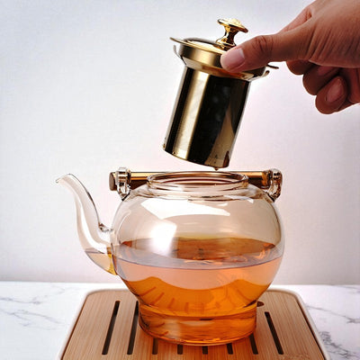 Théière en verre et doré