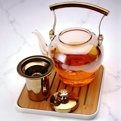 Théière en verre et doré