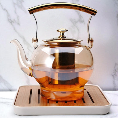 Théière en verre et doré