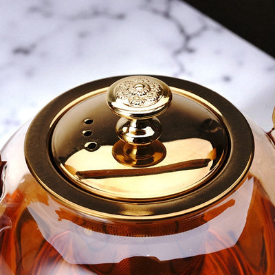 Théière en verre et doré