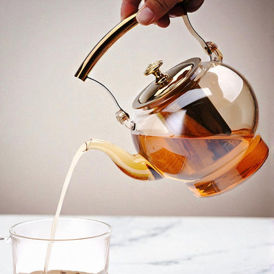 Théière en verre et doré