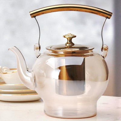 Théière en verre et doré